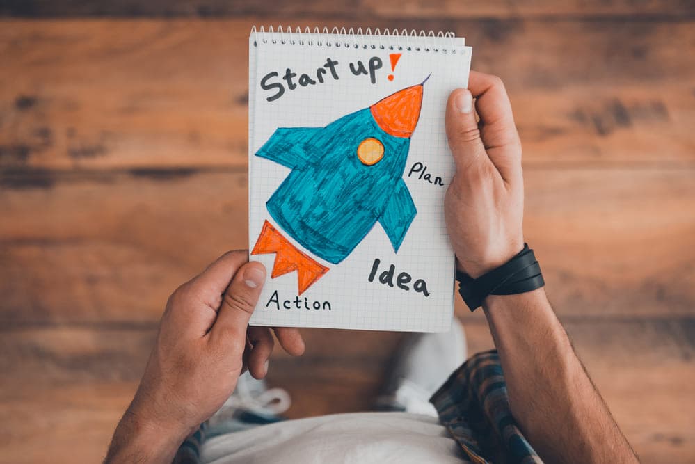 Person working on a laptop in a modern office